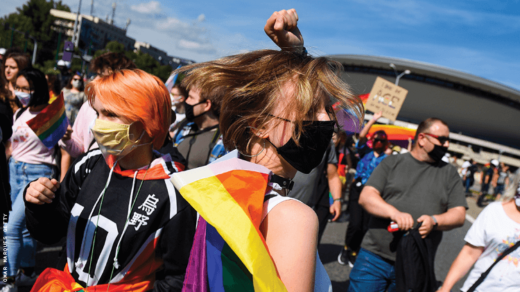 A Teenager Wearing A Rainbow Flag While Dancing 750x422 0