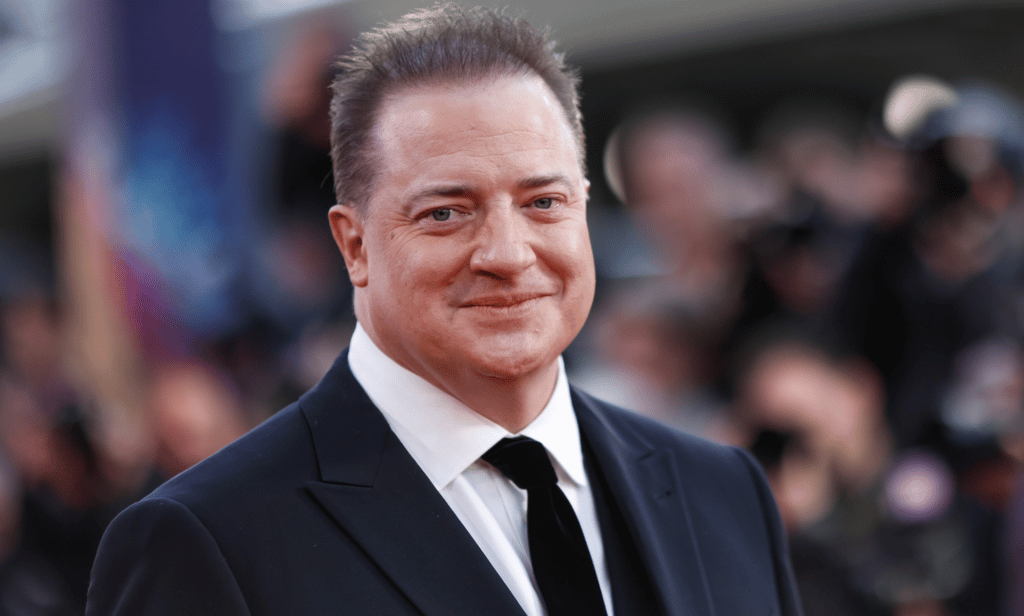 Brendan Fraser wears a suit and tie at an event for The Whale