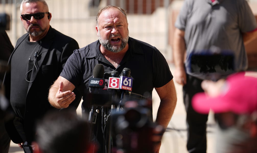 Alex Jones speaks to the media outside Waterbury Superior Court during the defamation trial in Connecticut